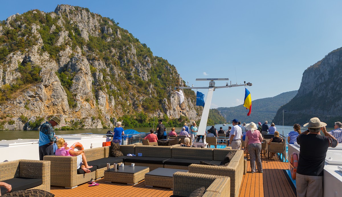 River cruise ship sailing through the Iron Gates gorge on the Danube