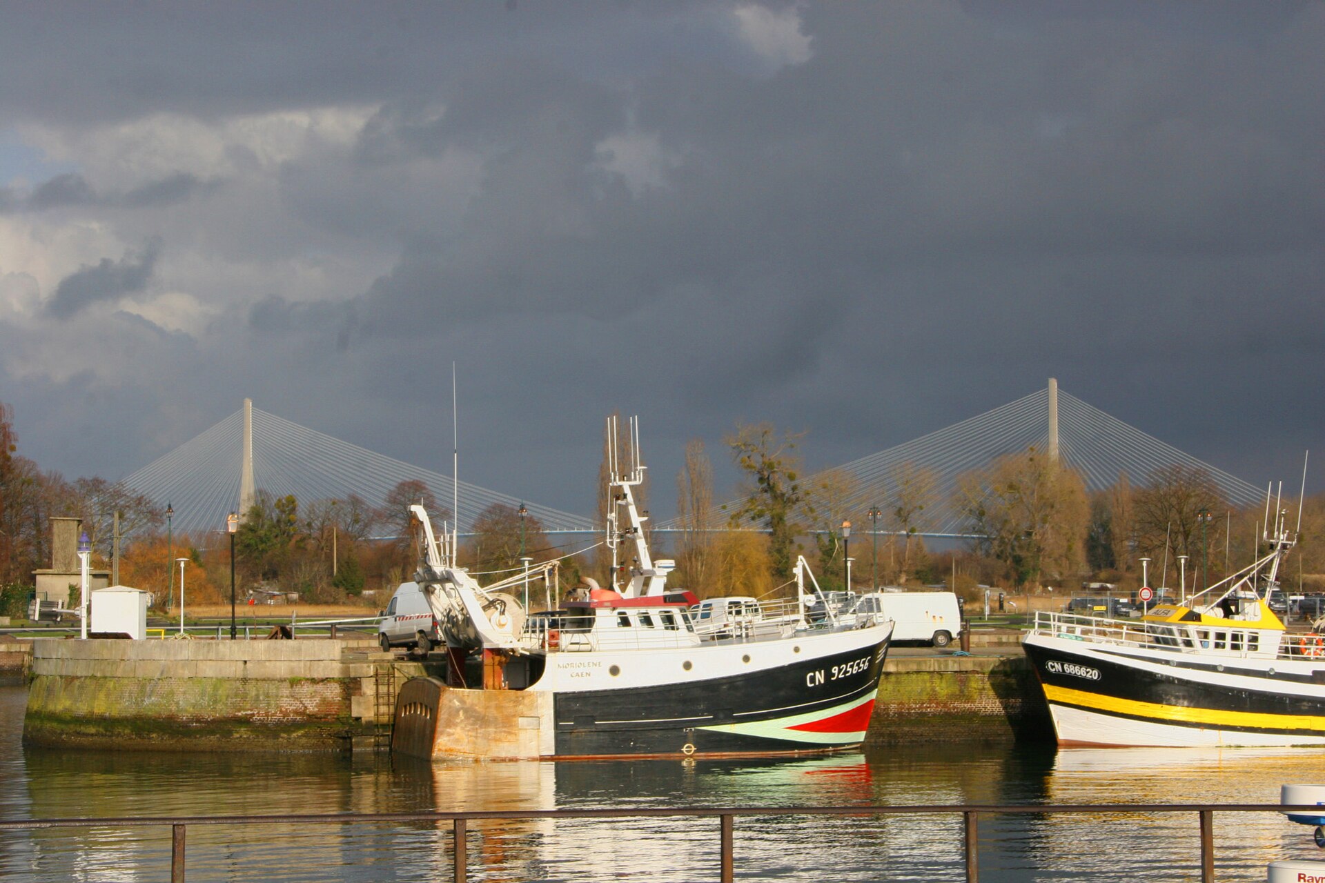 Boats and the Normandy Bridge seen from Honfleur harbour