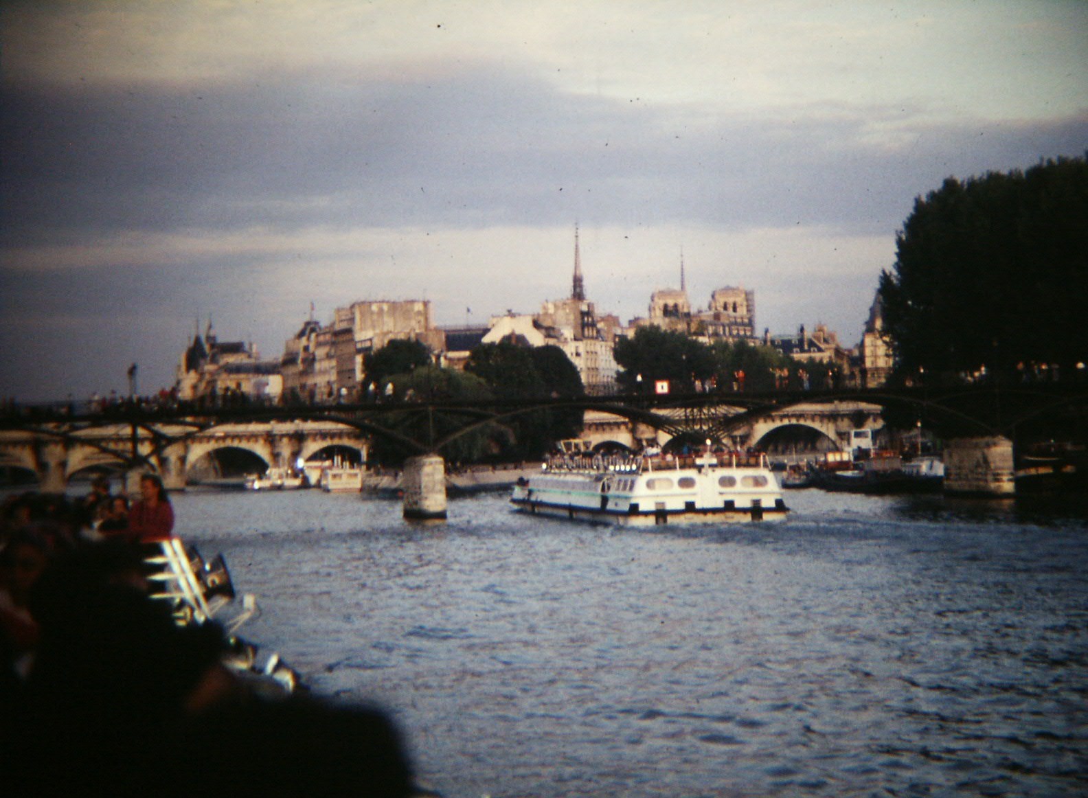 Sightseeing boat on the Seine passing the Ile de la Cite in Paris
